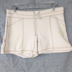 Athleta cream French terry shorts w/contrast stitching floral detail